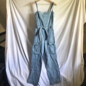 Free People light denim jumpsuit.